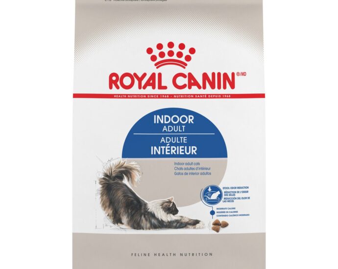 Royal Canin Indoor cat food kibble in a ceramic bowl beside the bag