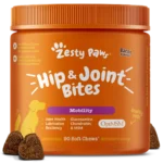 Zesty Paws hip and joint supplement soft chews spilled next to the jar